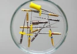 Multiple dental needles arranged in the shape of a 'O' at Unique Dental of Framingham, Massachusetts.